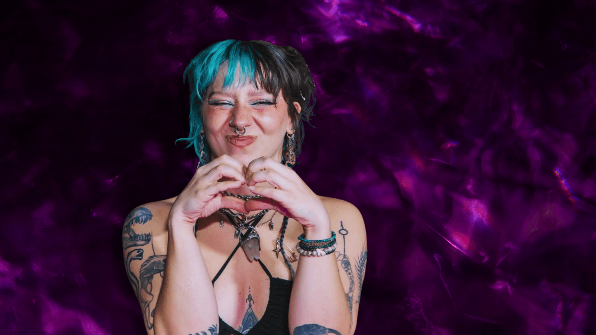 raver forming a heart with her hands
